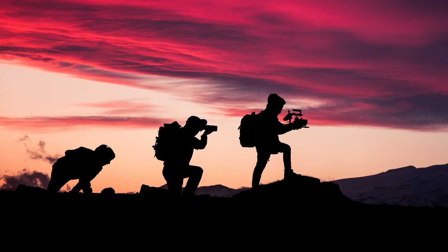 cameramen at sunset